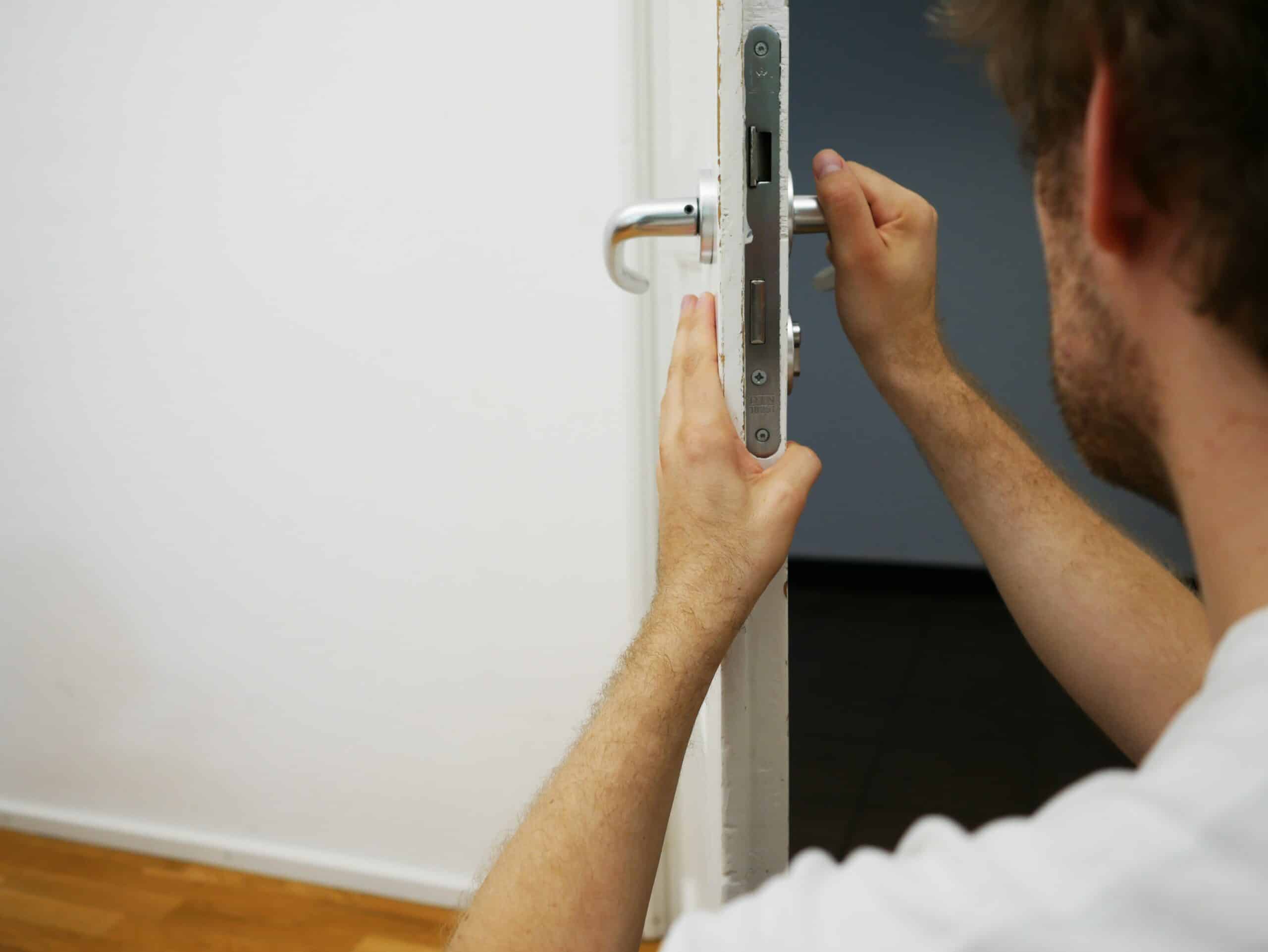 Locksmith changing door handle